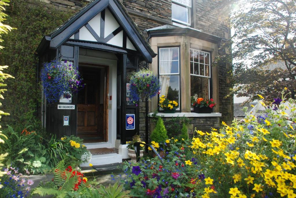 The flower-filled entrance and garden of Denehurst Guest House